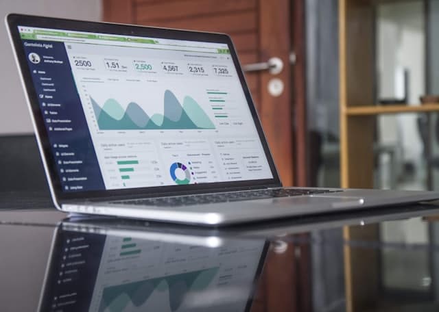 A laptop showing a product analytics dashboard